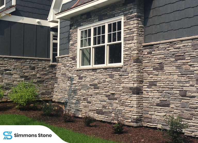 Close-up of a wall with natural stone siding showcasing texture and durability.